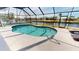 Inviting pool with a screened enclosure and waterfront views, ideal for swimming at 425 Belvedere Ct, Punta Gorda, FL 33950