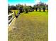 Expansive backyard view with well-maintained lawn and partial fencing, perfect for outdoor activities at 4344 Commercial St, Port Charlotte, FL 33953