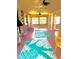 Airy living area showcases light-filled windows, pink floor, and tropical design at 4344 Commercial St, Port Charlotte, FL 33953
