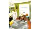 Bright office space with custom floral cabinets, hard wood floors, and a large window at 4344 Commercial St, Port Charlotte, FL 33953