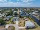 Aerial view of the property showcasing its location on a waterway and lush landscaping at 453 Carolyn Ln, Punta Gorda, FL 33950