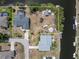 Aerial view highlighting the private waterfront property featuring canal access with space for boat storage and water activities at 453 Carolyn Ln, Punta Gorda, FL 33950