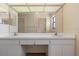 Bright bathroom with double sinks, large mirror, and neutral wall color at 453 Carolyn Ln, Punta Gorda, FL 33950