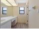 Bathroom featuring an extended vanity, bright lighting, and a large mirror at 453 Carolyn Ln, Punta Gorda, FL 33950