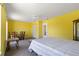 Bedroom with unique accents and a dining area under a ceiling fan at 453 Carolyn Ln, Punta Gorda, FL 33950