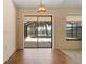Sliding glass doors open the dining space to views of the pool and canal at 453 Carolyn Ln, Punta Gorda, FL 33950