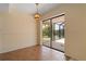 Charming dining area featuring sliding doors to the lanai, complemented by tile flooring at 453 Carolyn Ln, Punta Gorda, FL 33950