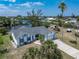 Charming exterior view of the house with a long driveway, attached garage, and well-maintained yard at 453 Carolyn Ln, Punta Gorda, FL 33950