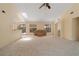 Spacious living room with neutral tones, plush carpeting, and ample natural light at 453 Carolyn Ln, Punta Gorda, FL 33950