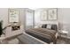 Well-lit bedroom featuring decorative wall art, a plush bed, and contemporary side tables at 4960 Tuscola Blvd, North Port, FL 34287