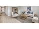 Spacious living room with comfortable seating, a stylish bookshelf, and a round coffee table at 4960 Tuscola Blvd, North Port, FL 34287