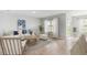 Bright living room with stylish furniture, large windows, and access to a patio, perfect for relaxation at 4960 Tuscola Blvd, North Port, FL 34287