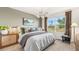 Tranquil bedroom with a large window, plush carpeting, and elegant decor at 5020 Schubert Trl, North Port, FL 34287