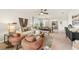 Comfortable living area with hardwood floors that connects to the dining area; offers lots of natural light at 5020 Schubert Trl, North Port, FL 34287