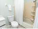 Bathroom featuring a white vanity, toilet, and a shower-tub combo at 5333 Simrak St, North Port, FL 34287