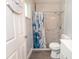 Bathroom featuring a white vanity, toilet, and a marble tiled shower at 5333 Simrak St, North Port, FL 34287