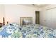 Bright bedroom featuring a decorative bedspread and ample closet space at 5333 Simrak St, North Port, FL 34287