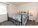 Cozy bedroom featuring a decorative bedspread, wood furniture and wood look floors at 5333 Simrak St, North Port, FL 34287