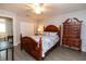 Bedroom featuring a decorative bedspread, wood furniture and tile floors at 5333 Simrak St, North Port, FL 34287