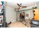 Versatile bonus room with a ceiling fan, decorative lighting, and ample room for storage or activities at 5333 Simrak St, North Port, FL 34287