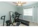 Exercise room featuring a treadmill, mirror and access to natural light at 5333 Simrak St, North Port, FL 34287