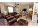 Spacious living room featuring tile flooring and access to dining room at 5333 Simrak St, North Port, FL 34287