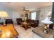 Bright and airy living room featuring a cozy seating area and tile flooring at 5333 Simrak St, North Port, FL 34287