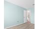 Bedroom featuring blue walls and ensuite bathroom for a relaxing ambiance at 5520 Kenwood Dr, North Port, FL 34287