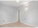 Neutral bedroom with wood-look floors, ceiling fan, and ample natural light at 5520 Kenwood Dr, North Port, FL 34287
