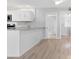 Bright kitchen with white cabinets, granite countertops, and modern appliances at 5520 Kenwood Dr, North Port, FL 34287