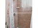 Tiled shower with shower curtain and shower head at 5520 Kenwood Dr, North Port, FL 34287
