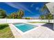 Backyard fenced pool has stone pavers and an adjacent well-maintained grassy area at 6245 Alhambra Ave, North Port, FL 34291