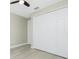 Bright bedroom with light walls features a closet and gray wood-look flooring at 6245 Alhambra Ave, North Port, FL 34291