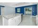 Modern kitchen island features a stainless steel dishwasher and granite countertop at 6245 Alhambra Ave, North Port, FL 34291