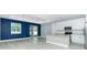Open concept living area with stainless steel kitchen appliances and a glass sliding door to patio at 6245 Alhambra Ave, North Port, FL 34291