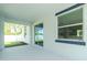Outdoor patio with view of fenced yard, grass, and sliding glass door at 6245 Alhambra Ave, North Port, FL 34291