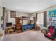 Spacious bedroom featuring bunkbeds, a desk, and a gaming setup with chair, creating a fun and functional space at 6531 Marius Rd, North Port, FL 34287
