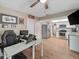 Bright office space adjacent to the kitchen boasts wood floors, a ceiling fan, and convenient access at 6531 Marius Rd, North Port, FL 34287