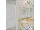 Bathroom with granite counters, bright lighting, and a vanity sink at 7135 Tropicaire Blvd, North Port, FL 34291