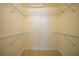 Walk-in closet with custom shelving for optimal storage solutions at 7135 Tropicaire Blvd, North Port, FL 34291