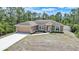 Beautiful single-Gathering home with a 2-car garage, and fresh landscaping at 7135 Tropicaire Blvd, North Port, FL 34291