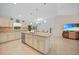 Spacious kitchen featuring stainless steel appliances and a large island, ideal for food preparation at 7135 Tropicaire Blvd, North Port, FL 34291