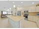 This expansive kitchen offers an island, stainless steel appliances, and ample counter space for cooking at 7135 Tropicaire Blvd, North Port, FL 34291