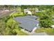 Aerial view of house showing gray roof, carport, and surrounding trees at 815 Papaya Dr, Tampa, FL 33619