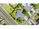 Birds eye view of neighborhood showing homes with gray roofs and mature trees at 815 Papaya Dr, Tampa, FL 33619