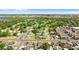 Scenic aerial shot of neighborhood homes surrounded by mature trees with a view of the nearby waterway at 815 Papaya Dr, Tampa, FL 33619