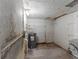 Basement with visible utilities, offering potential for storage or customization at 815 Papaya Dr, Tampa, FL 33619