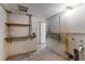 Basement space featuring storage shelves, needing some improvements at 815 Papaya Dr, Tampa, FL 33619