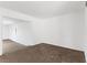 Large, bright living area featuring neutral walls and carpet with easy access to other rooms at 815 Papaya Dr, Tampa, FL 33619