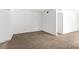 Spacious living room with neutral carpet and freshly painted walls at 815 Papaya Dr, Tampa, FL 33619